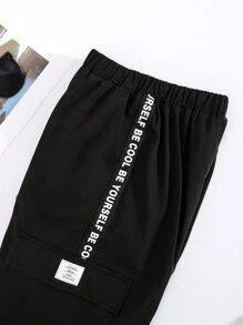 SHEIN Calças Folgadas De Tecido Casual Resort Para Meninos Adolescentes Com Patch De Letras E Bolsos De Patch Tridimensionais.