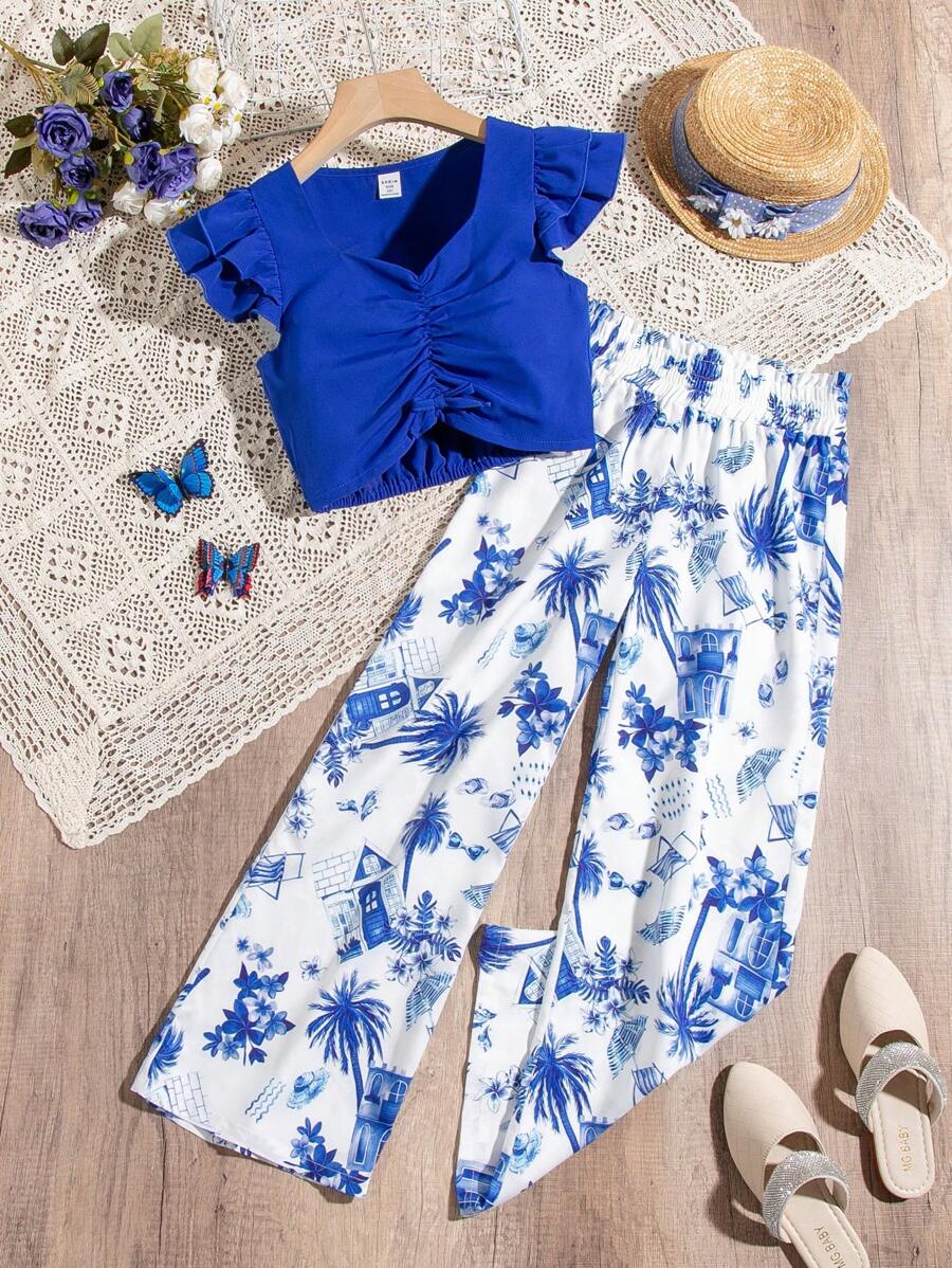 SHEIN Conjunto De Dos Piezas Para Las Vacaciones De Verano Para Niñas Adolescentes, Top De Manga Corta De Color Azul Y Pantalón Ancho Estampado - Azul - Ver 1