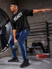 Manfinity Sport Corelite Freund-Stil Herren Sport T-Shirt mit Buchstabendruck Workout Oberteile