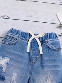 SHEIN Leap Crew 年轻女孩休闲中腰弹力腰带假门襟不对称剪裁破洞牛仔裤，带卷边下摆设计 - 淺色水洗藍 - 查看 4