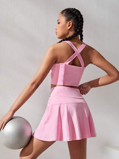 سترة علوية محبوكة للفتيات المراهقات بلون سادة متقاطعة مع حزام خصر على شكل حرف V وتنورة رياضية قطعتين