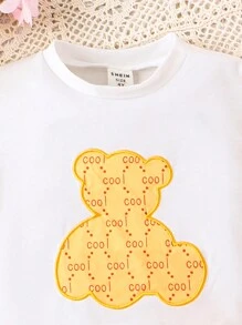 SHEIN Young Girl Cartoon Bear Print Short Sleeve T-Shirt And Shorts Set
