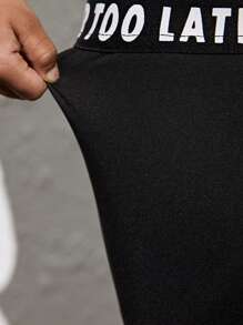 SHEIN 2 件套年轻女孩字母图案短款上衣长袖衬衫和紧身裤运动套装 - 黑色 - 查看 3