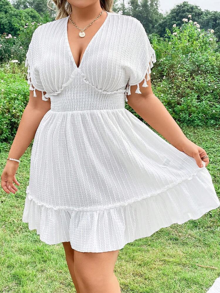Plus Size Dress With Tassel Sleeve Cuffs And Ruffled Hem