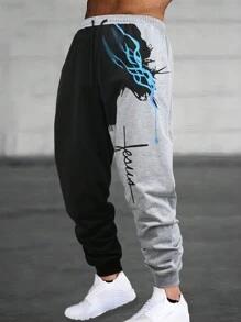 Manfinity Roughcore Pantalon de survêtement pour hommes avec cordon de serrage à la taille, imprimé en blocs de couleurs et lettres. Pantalon de survêtement graphique pour sortir, style gothique, cadeau pour petit ami, pour rave - Multicolore - Voir 1