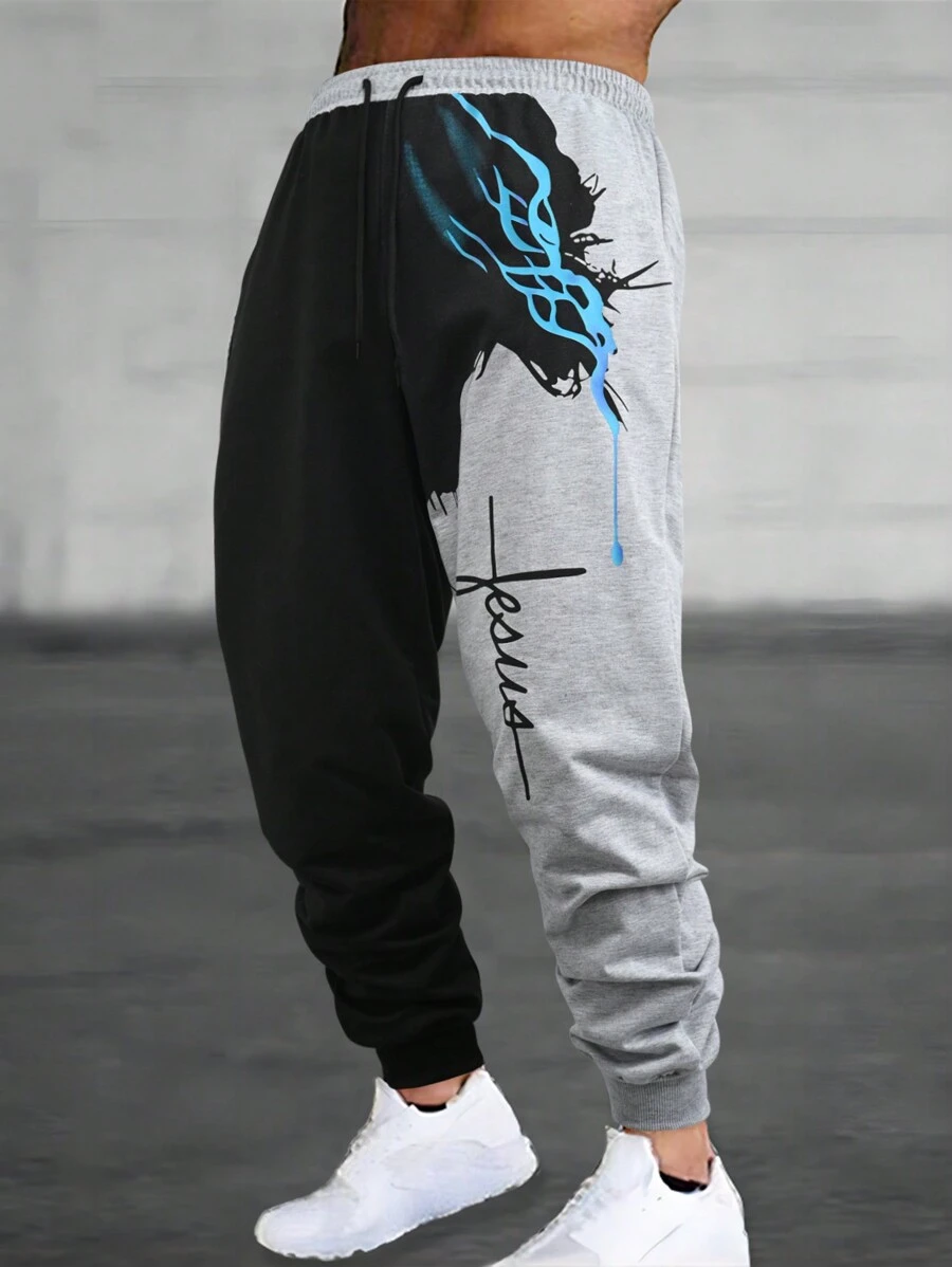 Manfinity Roughcore Pantalon de survêtement pour hommes avec cordon de serrage à la taille, imprimé en blocs de couleurs et lettres. Pantalon de survêtement graphique pour sortir, style gothique, cadeau pour petit ami, pour rave - Multicolore - Voir 1
