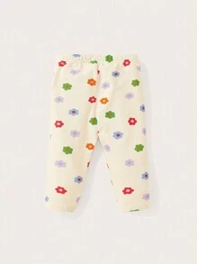 Cozy Pixies Baby Girl Snug Fit Pajama Set With Slogan Printed Short Sleeve Top And Flower Printed Pants - Apricot - View 2