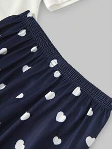 Conjunto de pijama de manga curta com top temático Tween Girl e calça estampada com corações
