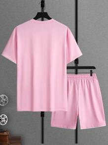 Manfinity Homme Conjunto de camiseta de manga corta y pantalones cortos con recorte de color bloque rosado para salir, para hombre