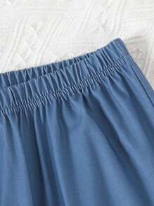 青少年男孩寬鬆版式2入組休閒居家服,特色為字母印花短袖t恤和橡筋腰帶長褲