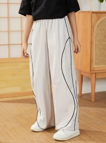 SHEIN Tween dziewczynka Luźny, casual Koreański Styl Kolorowe bloki Joggersy Z Elastyczny Pasek w talii & Litera Nadrukowany , Codzienna odzież