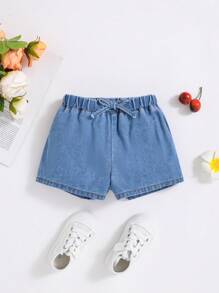 SHEIN Nuevos shorts de mezclilla para niña joven con lazos lindos de muñeca, cómodos, casuales y lavados para las vacaciones de verano bajo la luz del sol