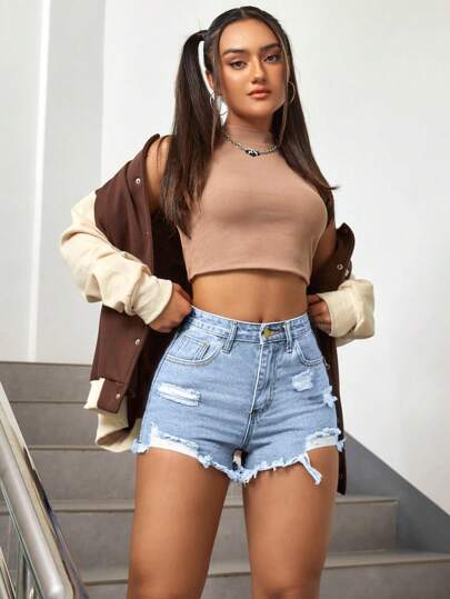 Shorts in denim vita alta con strappati con orlo grezza