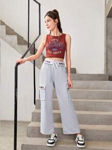 Conjunto De Top Deportivo Estampado Y Pantalones Deportivos Con Bolsillo Y Cordón Para Chicas Adolescentes Que Prefieren Un Estilo Deportivo Y Cómodo