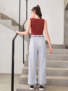 Conjunto De Top Deportivo Estampado Y Pantalones Deportivos Con Bolsillo Y Cordón Para Chicas Adolescentes Que Prefieren Un Estilo Deportivo Y Cómodo