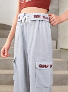 Conjunto De Top Deportivo Estampado Y Pantalones Deportivos Con Bolsillo Y Cordón Para Chicas Adolescentes Que Prefieren Un Estilo Deportivo Y Cómodo