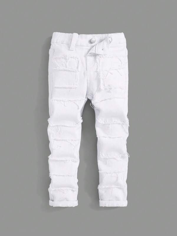 SHEIN Jeans de mezclilla blanca casual rasgada para niños pequeños