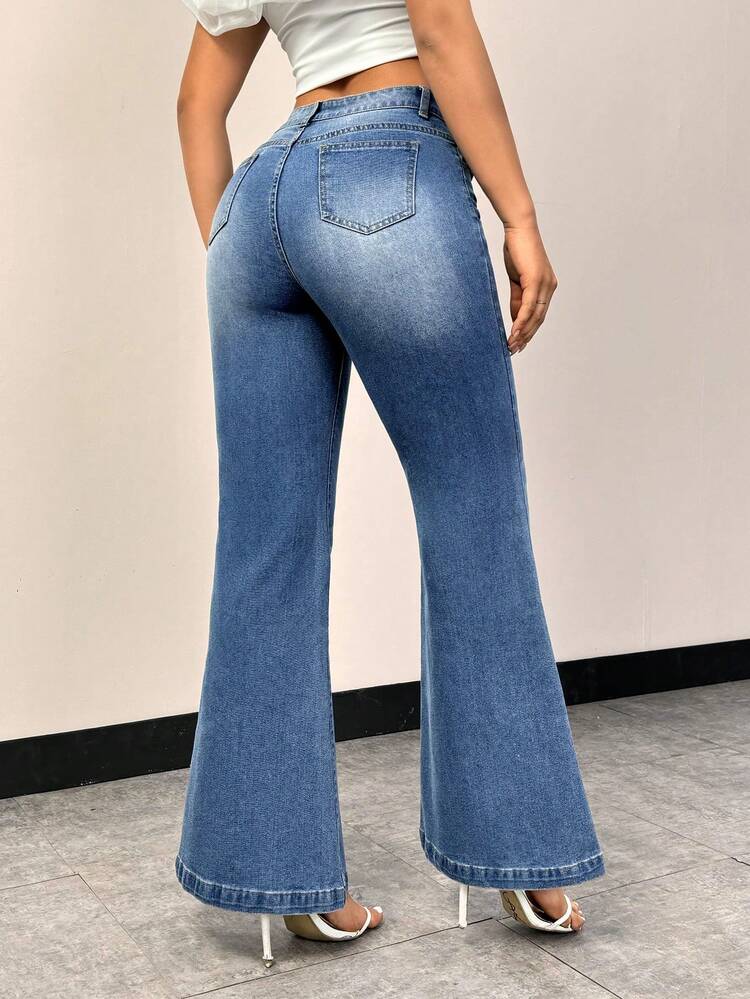 Washed Flared Jeans With Distressed Details