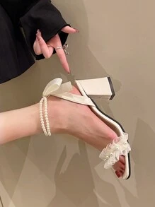 女性夏季新款蝴蝶結箍帶涼鞋，十字帶厚跟和高跟鞋