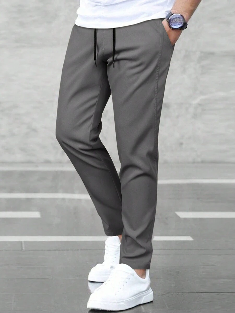 Manfinity Homme 男士纯色抽绳腰斜口袋长裤，适合秋季