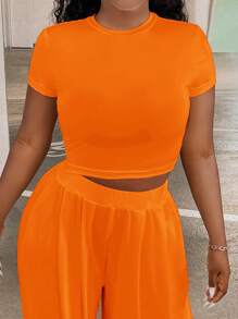 Slaydiva Conjunto De Camiseta De Manga Corta De Cuello Redondo En Color Sólido Y Pantalones Para Mujer