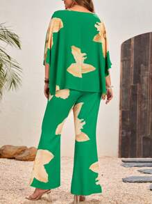 SHEIN VCAY Plus Size Floral Printed Asymmetrical Neckline Top And Flared Pants Two-Piece Set