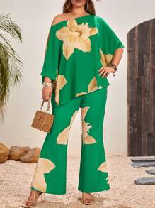 SHEIN VCAY Plus Size Floral Printed Asymmetrical Neckline Top And Flared Pants Two-Piece Set