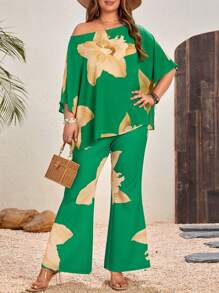 SHEIN VCAY Plus Size Floral Printed Asymmetrical Neckline Top And Flared Pants Two-Piece Set