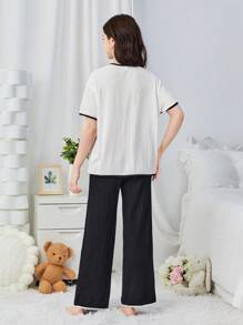 SHEIN 少女下擺短袖鈕扣襯衫及直筒褲顏色區塊睡衣套裝,附對比邊飾細節 - 黑與白 - 查看 2