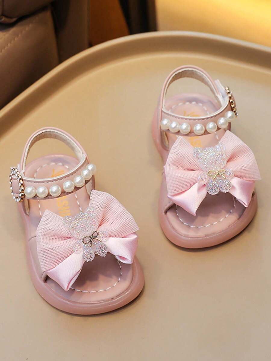 2026新款女童粉色蝴蝶结珍珠凉鞋，防滑软底，不吱吱作响，高评分公主鞋，适合夏季、上学和旅行的百搭儿童鞋 - 粉色 - 查看 1