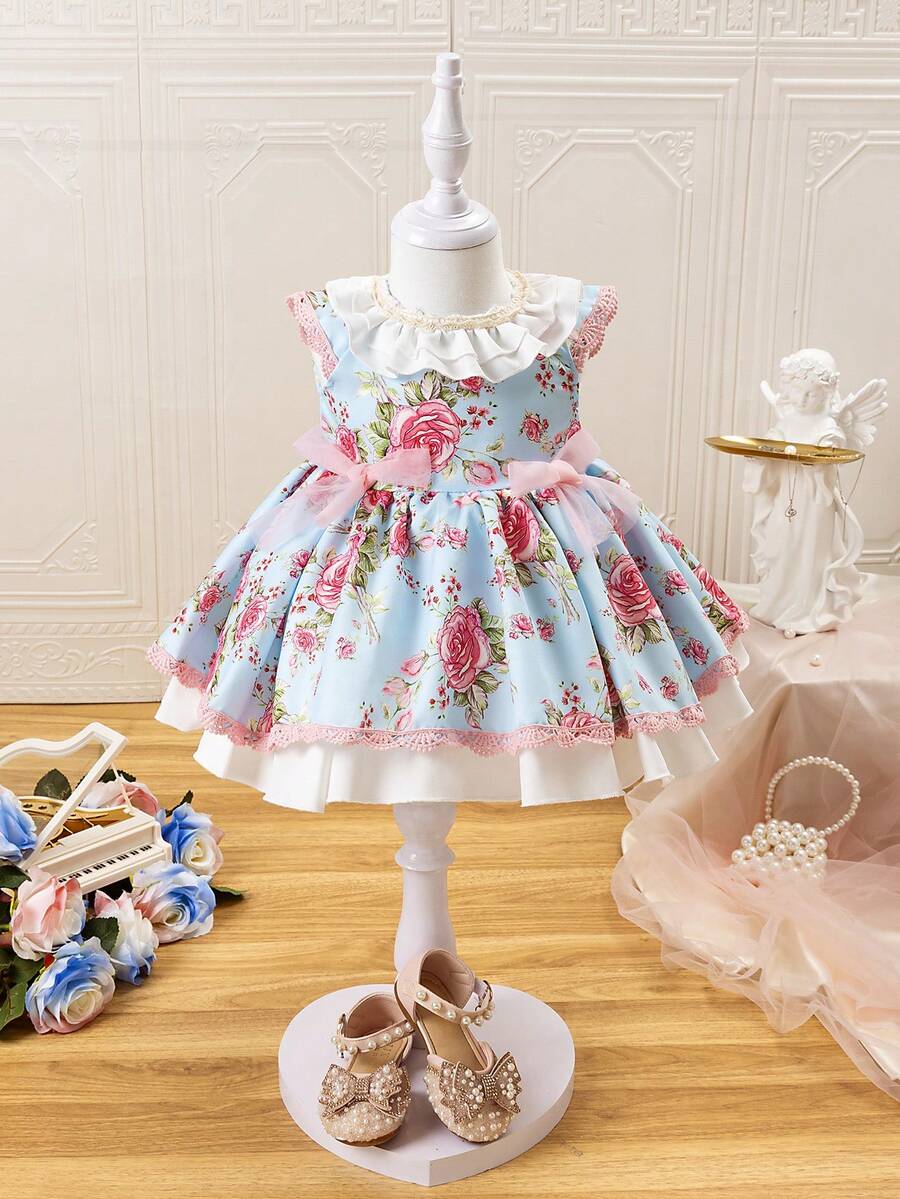 SHEIN Vestido de princesa de doble capa con lazo decorativo estampado de flores de moda y dobladillo con volantes para bebé niña - Multicolor - Ver 1