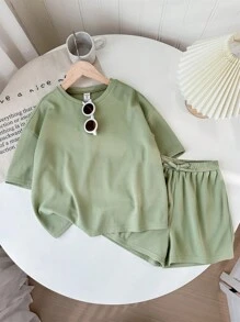 SHEIN LMoss Kids Conjunto de camiseta de cuello redondo de manga corta y pantalones cortos de unicolor tejidos para niña preadolescente para festival de música