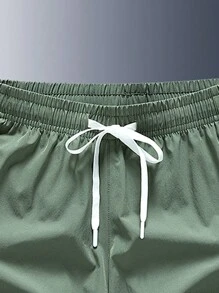 Men's Letter Print Pocket Casual Loose Drawstring Waist Shorts