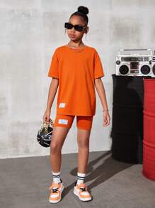 SHEIN Leap Crew Tween Girl Dệt Kim Màu Trơn Cổ Tròn Thư Giãn Áo Phông Có Chữ Cái Logo Phù Hợp Với Dệt Kim Thư Giãn Bộ Quần Short - trái cam - Xem 5