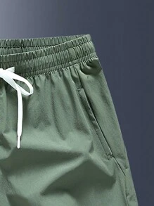 Men's Letter Print Pocket Casual Loose Drawstring Waist Shorts