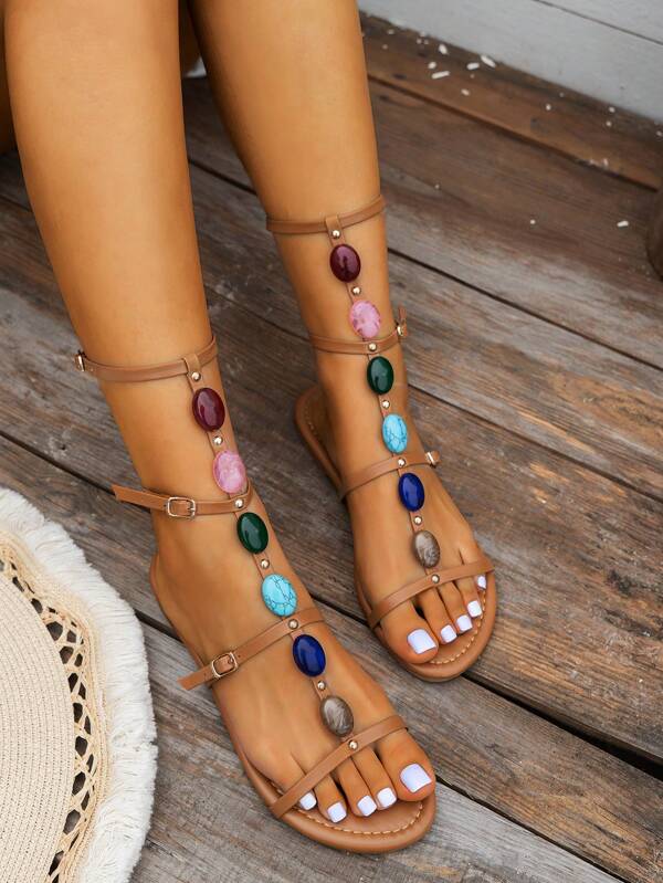 Sandali piatti estivi da donna eleganti e comodi, con fibbia e laccetti colorati, con perle, adatti a vacanze in spiaggia