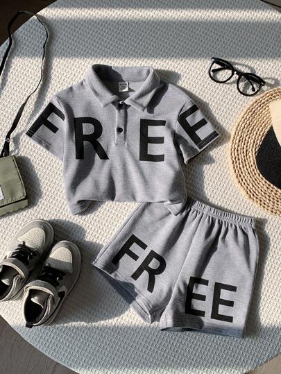 SHEIN 寶寶男孩波羅領寬鬆上衣短袖t卹,大字母印花及休閒短褲兩件套
