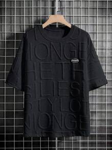 Claim Dot 男士寬鬆下垂短袖t卹,帶有字母徽章 - 黑色 - 查看 3