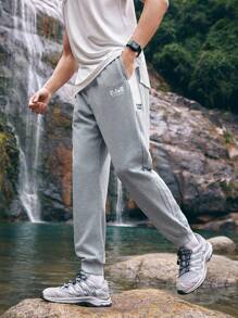 In My Nature Men's Spring Outdoor Joggers With Printed Letters, Elastic Waistband And Drawstring, Side Pockets And Elastic Cuffs