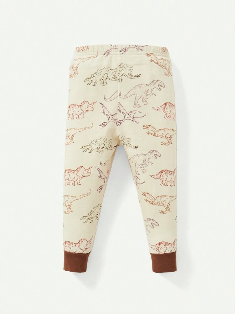 Ensemble de pyjama pour bébé garçon avec motif dinosaure dessin animé, haut à manches longues à col rond en couleur contrastante et pantalon à pieds ajusté