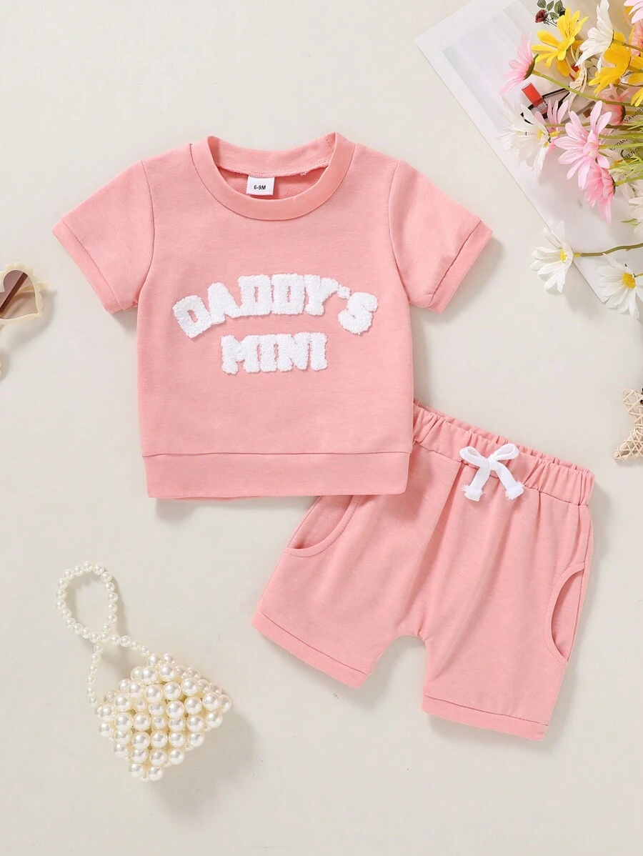 2 piezas Camiseta de niña bebé con gráfico de letras y lemas, suave y cómoda, y shorts deportivos de unicolor, conjunto casual de verano para vacaciones - Rosa - Ver 1