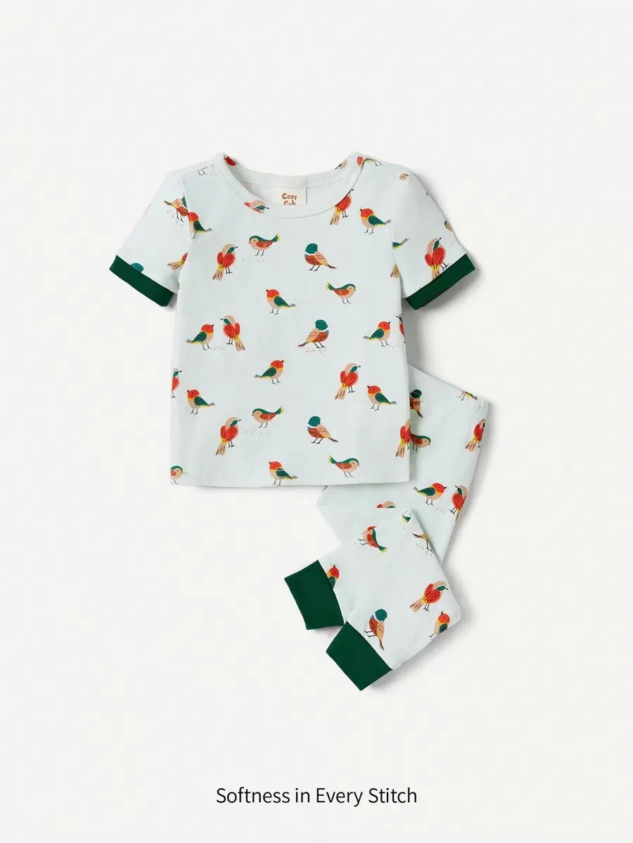 Cozy Pixies Conjunto de pijama para bebé niño con parte superior de cuello redondo de manga corta y estampado de pájaro de dibujos animados, y pantalones - Verde - Ver 1