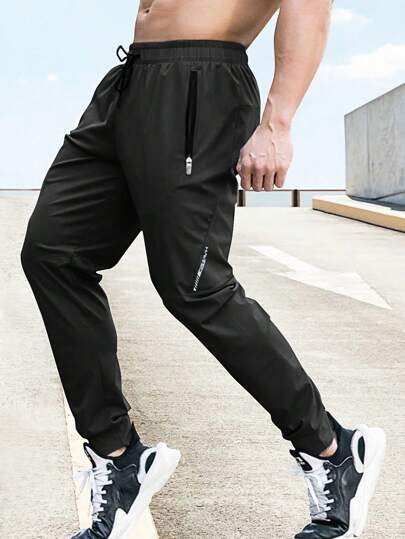 Manfinity Sport Corelite Boyfriend Style Men Drawstring Waist Zip Pocket Sports Pants, Men's Jogger Pants, Lightweight Workout Pants Fall Fall Breathable