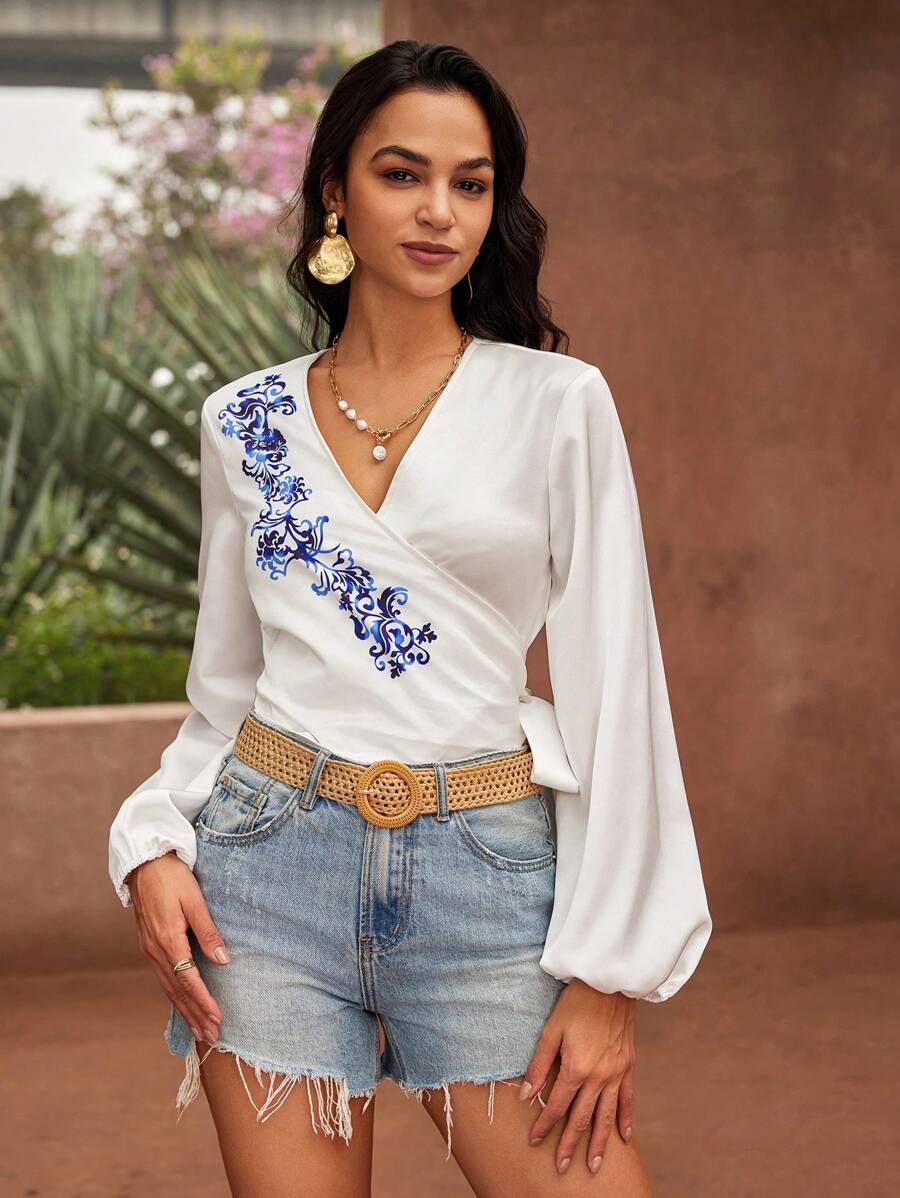 GENKIRA Áo cánh tay dài nữ in họa tiết in quấn nơ tay áo thun co giãn - Xanh và trắng - Xem 1