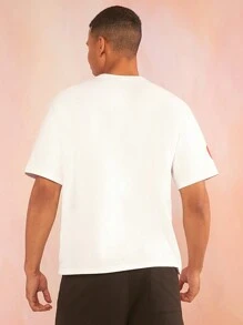 SHEIN X Care Bears Camiseta blanca de manga corta floja casual para hombre con estampado de oso Care Bear de patrón veraniego y divertido de dopamina - Blanco - Ver 2