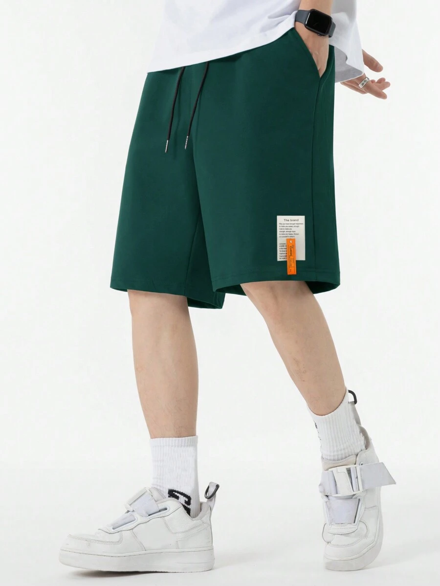 Manfinity Hypemode Loose Fit Men Shorts With Slogan Graphic Patches - Dark Green - View 1