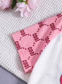 SHEIN Conjunto de pijama cómodo informal y lindo para niña joven con patrón de dibujos animados en la parte superior de manga raglán corta y shorts