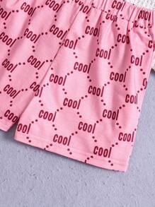 SHEIN Conjunto de pijama cómodo informal y lindo para niña joven con patrón de dibujos animados en la parte superior de manga raglán corta y shorts