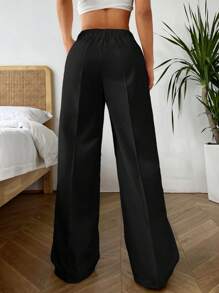 SHEIN EZwear Pantalones casuales de pierna ancha y ajuste holgado con pliegues y bolsillos oblicuos, de unicolor