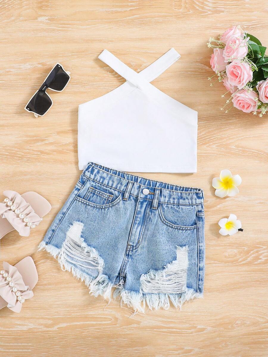 SHEIN Conjunto de ropa de niña preadolescente para primavera y verano con boho, formado por 2 piezas: blusa con cuello colgante de tirantes y pantalones cortos vaqueros de mezclilla con flecos y rotos al estilo desgastado y lavado con piedra, conjunto de prendas de vestir para niñas en verano